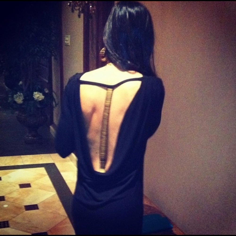 Super sexy low back dress with gold accent running down the back.